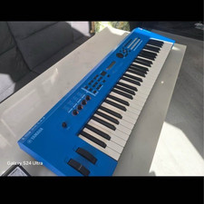 Yamaha MX61 61-Key Blue Synth Action Electronic Keyboard with Carry Bag