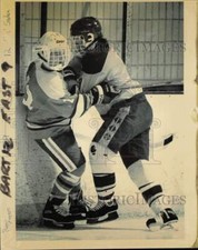 1991 Press Photo Bart's Roger Meyers checks East's Bill Saden in hockey action