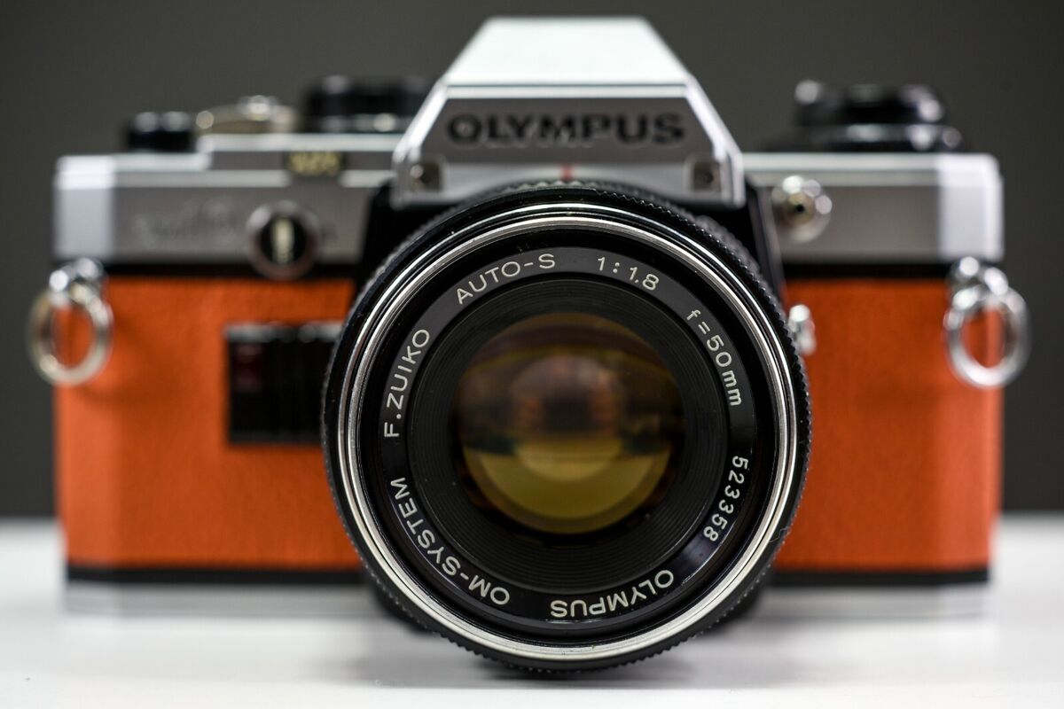 OLYMPUS OM10 35mm Film Camera w/ 50mm f/1.8 Zuiko Lens Orange Leather |  Serviced