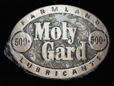 PL25123 NOS 1980s MOLY GARD 500 FARMLAND LUBRICANTS SOLID BRASS BELT BUCKLE