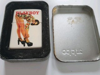 A Playboy 50th Anniversary Retro Girl Zippo Lighter. 2004. Boxed & Unused.