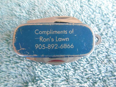 VINTAGE COMPLIMENTS OF RON'S LAWN BLUE 4 BLADE MULTI TOOL POCKET KNIFE.