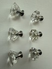 Drawer knobs that are Crystal like.  Plastic.  Less than 1 inch wide. Quantity 6 — photo 1