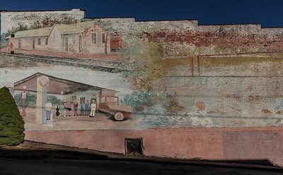 faded historical mural Hardy, town whose downtown main street is famous s