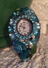 FLORAL COLORED METAL / GOLD TONED HINGED CLAMPER BRACELET WATCH