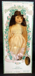 limited collection genuine porcelain doll and matching miniature ornament