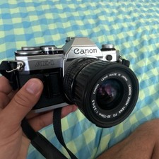 Canon AE-1 Black Silver SLR Film Camera with 35-70mm Zoom Lens