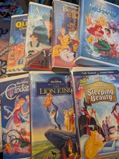 Lot of 7 Walt Disney Animated Movies VHS Tapes Classics Clam Shell Cases