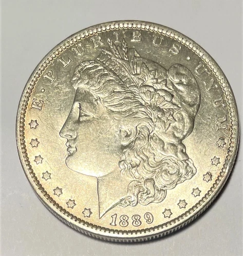 1889-O ABOUT UNCIRCULATED MORGAN SILVER DOLLAR -SEMI-KEY DATE