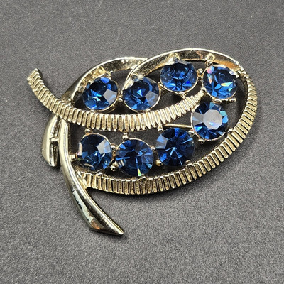 Stunning Signed Kramer Brooch Pin Gold Tone and Blue Crystal Rhinestones