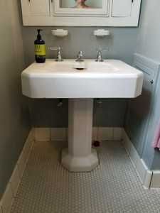 Antique-pedestal-sink-with-Kohler-faucet
