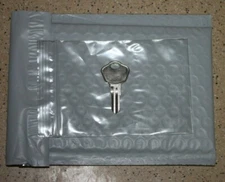 1 key Sentry Safe with code on the front of the lock A-B-C-G-H-I-J-K-L-M-O-U-W-Z