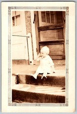 Vtg B&W Snapshot Cute Baby Toddler Girl Dress Sitting Porch Steps Steps 1920s