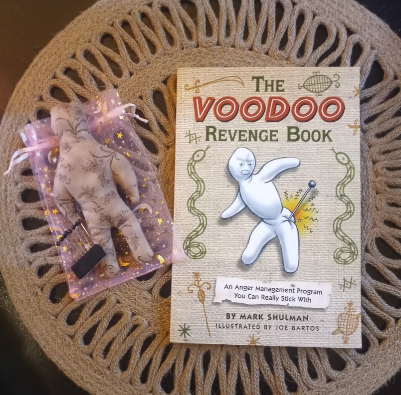voodoo doll and book by Mark Schulman 