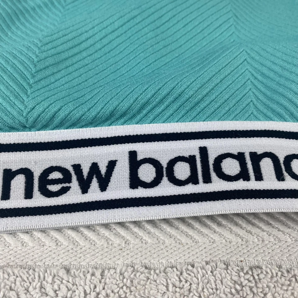 Sujetador deportivo New Balance para mujer grande verde azulado acanalado espalda deportiva logotipo elástico atlético Foto 2 de 4