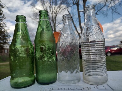 Lot Of 4 Vintage Soda Bottles (Coke, Sprite, & Fanta).