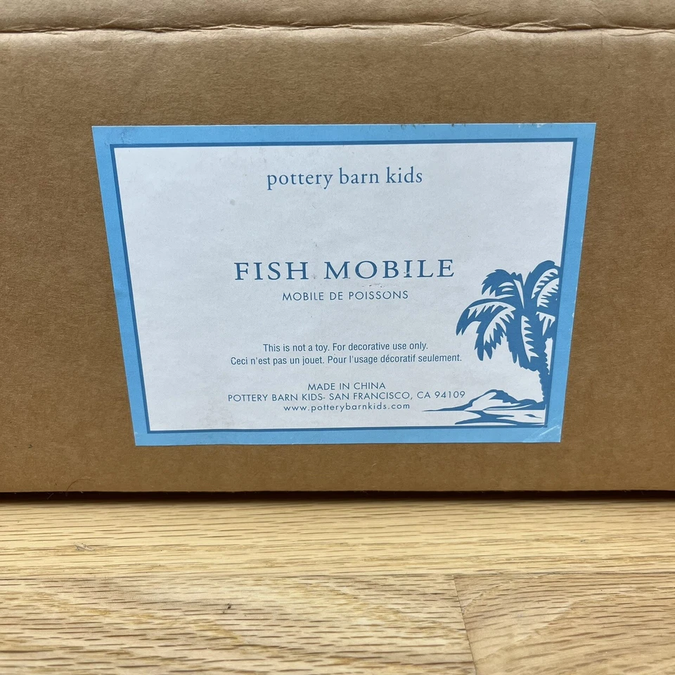 Carrusel móvil para bebés Pottery Barn niños peces de madera guardería náutica multicolor Foto 2 de 4