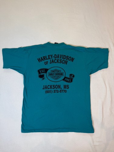 Teal Harley-Davidson men’s XL T-shirt with black “Est. 1903 Jackson, MS” text and logo on back.