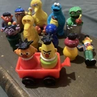 Vintage Sesame Street Vintage Little People and applause figures.