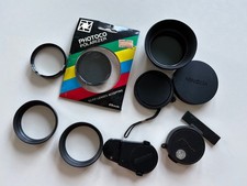 11 Different Size Lens Caps, Filters, Hoods, etc.