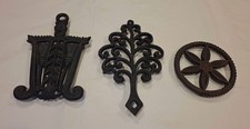 LOT OF (3) WILTON CAST IRON Tassel & Grain Broom, Tree Of Life, Pin Wheel Trivet