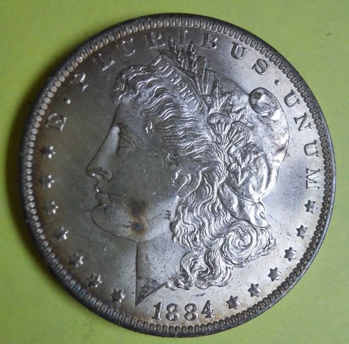 1884 O AU Morgan Silver Dollar... 90% silver... excellent detail and luster