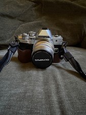 Silver Olympus OM-D E-M10 Mark IV Camera With Three Lenses