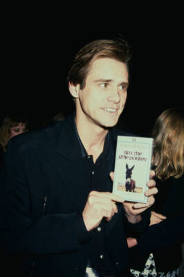 Jim Carrey holds up Bim The Little Donkey VHS tape Cobb Beverly Hi- Old Photo