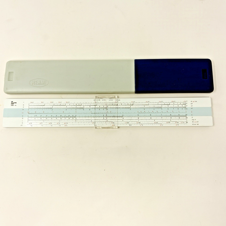 A beautifully preserved mid-century Japanese-made slide rule from Teledyne Post — the kind of precision instrument that put men on the moon before calculators existed.