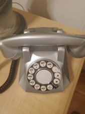 Old phone. Grey w white touch pads. Touch tone.