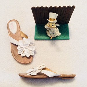 white flower flip flops
