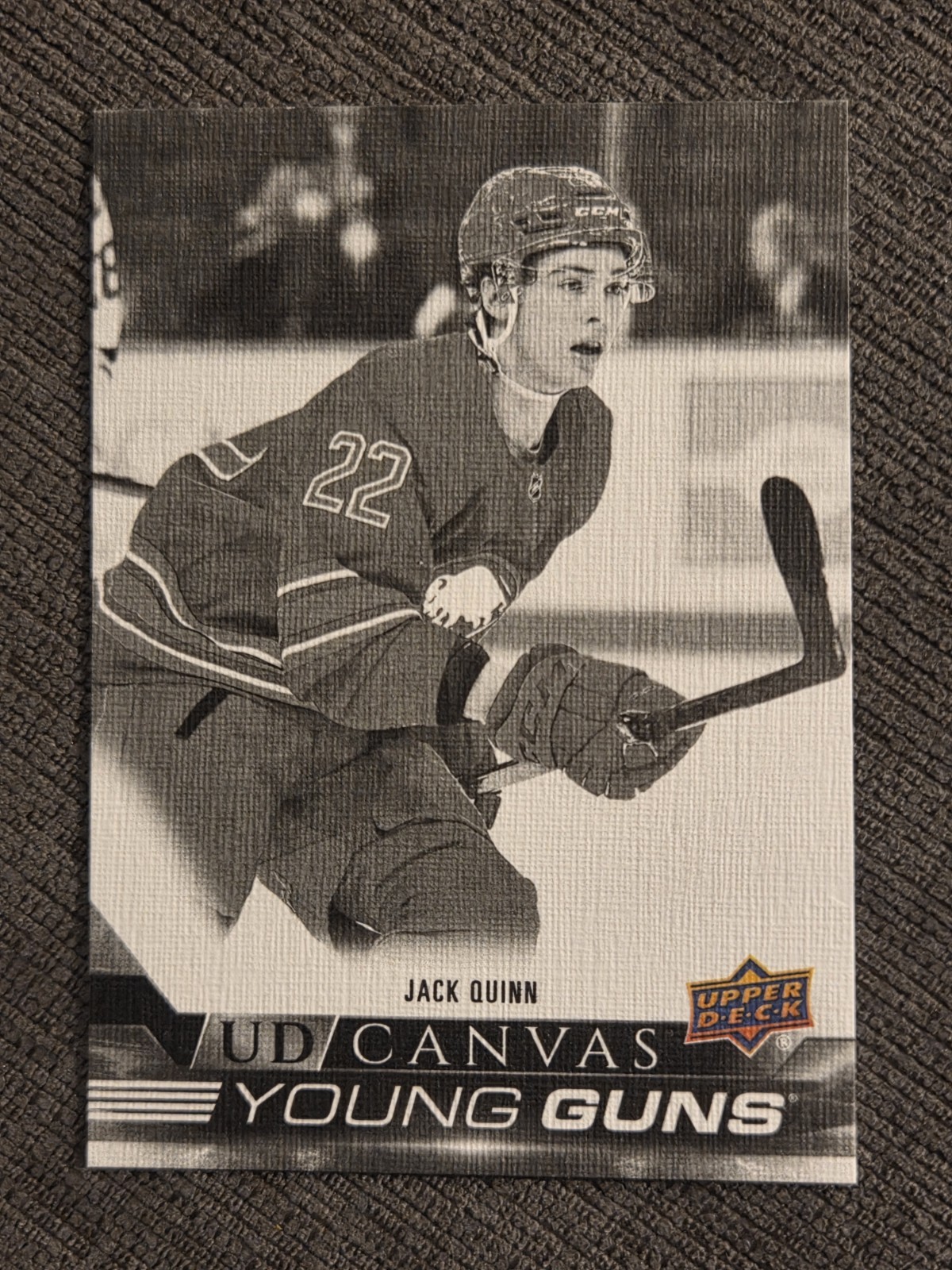 Jack Quinn 2022-23 Upper Deck Series 1 Canvas Young Guns #C99 Black & White (RC)