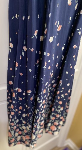 Navy blue midi dress with small white floral print, scalloped neckline, and “E.D. Michaels” label on inner collar.
