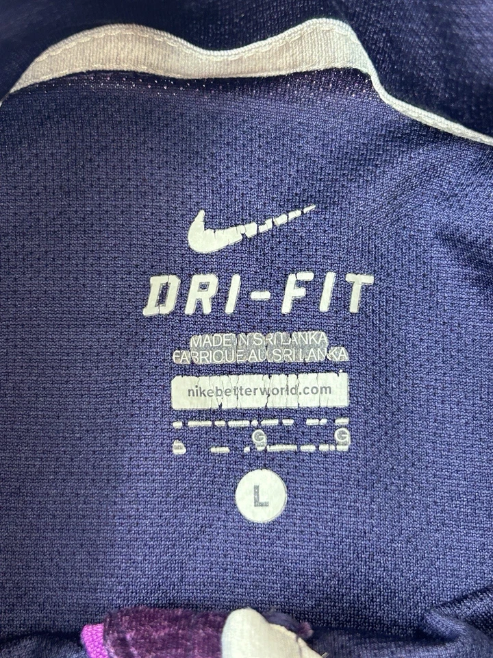 Pullover para correr Nike para mujer media cremallera manga larga Dri Fit púrpura rendimiento Foto 3 de 4