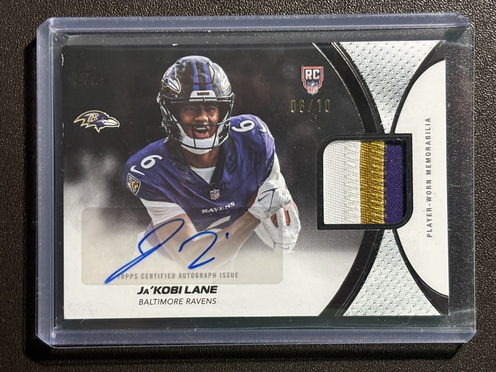 2026 Ja'Kobi Lane Topps Flagship Rookie Material Auto Patch Black /10 Ravens SSP view 1