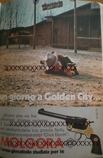 FOTO DI GIOCATTOLO: PISTOLA NELLY MOLGORA.  1 PAGINA DA TOPOLINO ANNI 70'