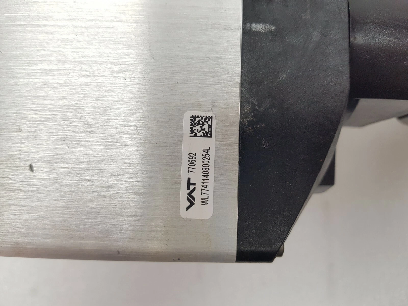 Close-up of the VAT label reading 770692 on the valve controller housing