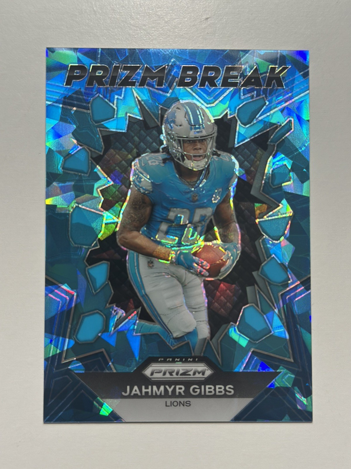 2023 Panini Prizm - Prizm Break Jahmyr Gibbs #PB-5 Blue Ice Prizm 90 /99 (RC)