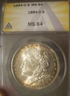 1884 O Morgan Silver Dollar - BU ANACS MS 64, Colorful peripheral toning 4073