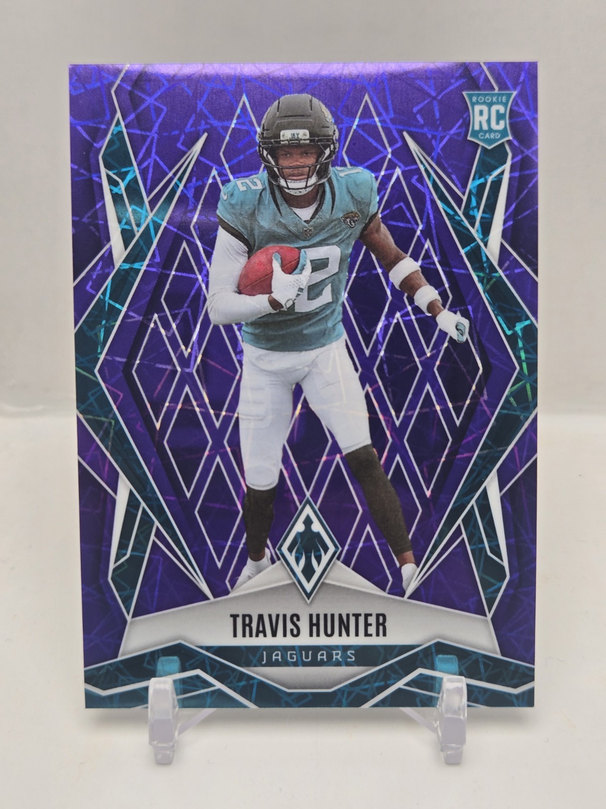 2025 Panini Phoenix Rookies Travis Hunter #157 Purple Lazer /99 Jaguars 