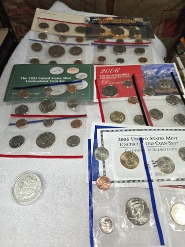 Coin Lot # 245 With  4 P&D  UNC Coin Sets. One Morgan Silver Dollar,