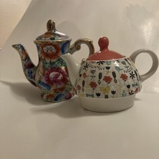 2 Childs teapots floral design