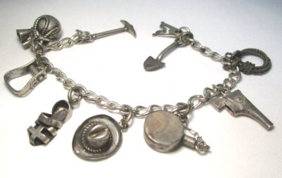 Test Silber Bettelarmband - Gold Prospector 49 s Motiv 24,8 Gramm 9 Charms