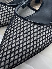 pointed-toe slingback pump with a low heel, in a mesh or netted style.