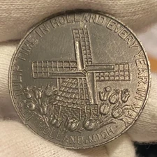 T'S TULIP TIME IN HOLLAND MICH. EVERY YEAR IN MAY  TOKEN ~1951 ~ GOOD FOR 25 ¢
