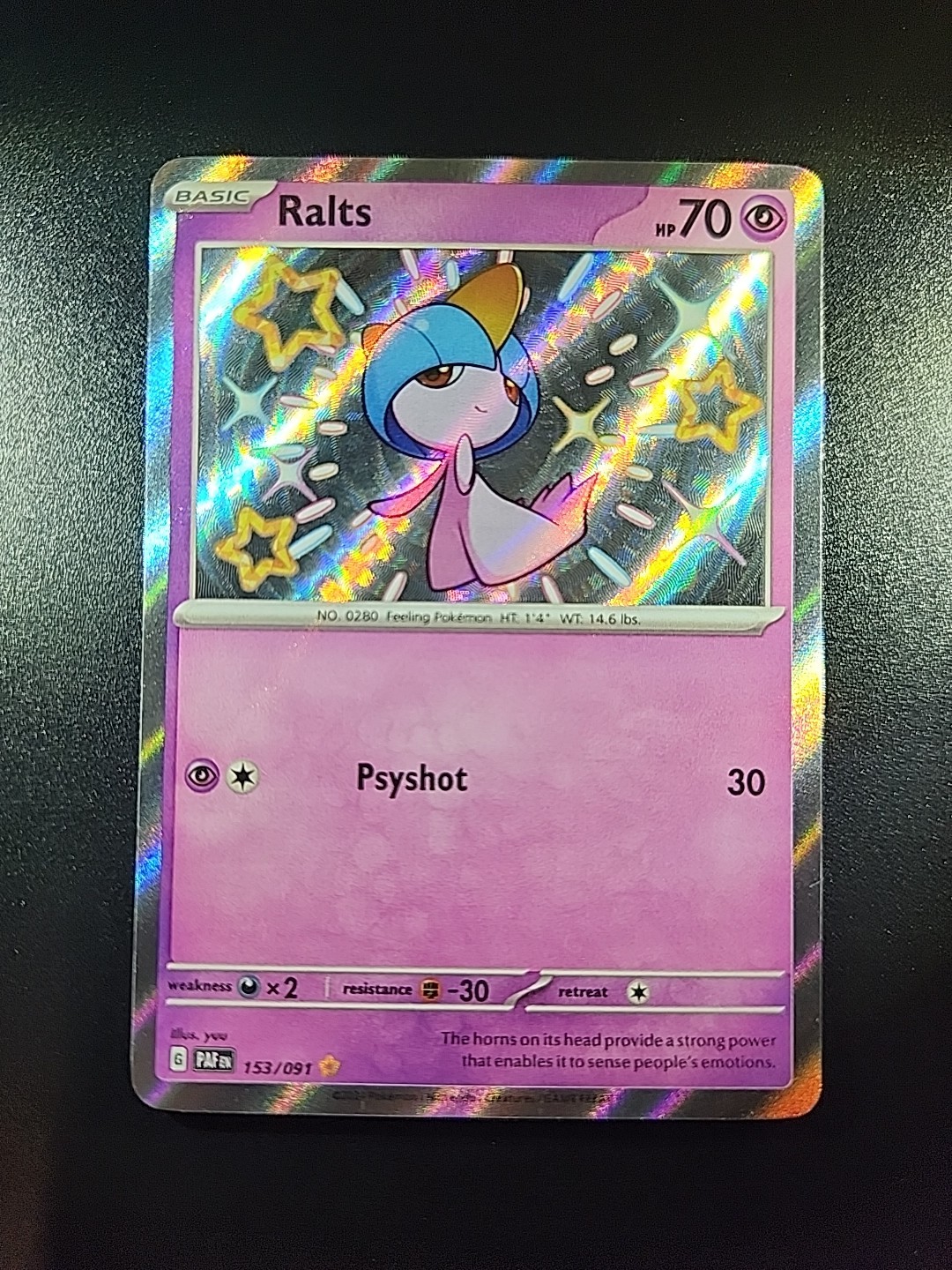 Ralts 153/091 SV: Paldean Fates Holo
