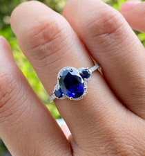 Lab Created Blue Sapphire 2 Ct Oval Cut Halo Women's Ring 14K White Gold Plated