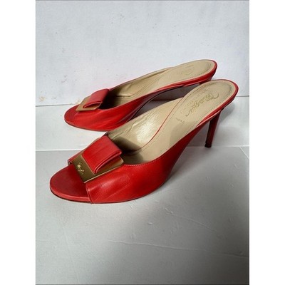 Bruno Magli leather mules with a gold-tone hardware plaque