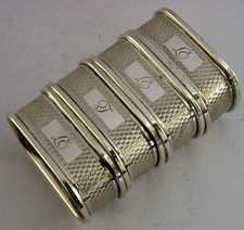 FOUR ENGLISH SOLID STERLING SILVER ENGINE TURNED NAPKIN RINGS 1959/60