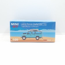 MINI GT LAND ROVER DEFENDER 110 LIGHT BLUE W/ SURFBOARD MGT00109 LHD SEALED